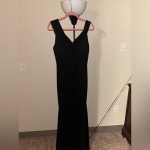 Black floor length formal dress.